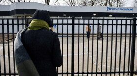 An activist with 40 Days for Life prays as she stands outside the Columbia Planned Parenthood clinic on Monday, March 3, 2025 shortly after the clinics restarted procedural abortions under the state's reproductive rights amendment (Anna Spoerre/Missouri Independent).
