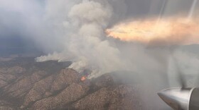 The Frijoles Fire is seen burning northeast of Santa Fe, New Mexico, on Monday, Aug. 10, 2026. The fire sparked on Aug. 4 and has grown to about 7,800 acres with just 1% containment as of Aug. 13.