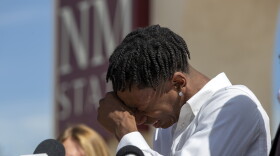 Former New Mexico State NCAA college basketball player Deuce Benjamin breaks down in tears while speaking at a news conference in Las Cruces, N.M., Wednesday, May 3, 2023. Benjamin and former Aggie player Shak Odunewu discussed the lawsuit they filed alleging teammates ganged up and sexually assaulted them multiple times, while their coaches and others at the school didn't act when confronted with the allegations. (AP Photo/Andres Leighton)