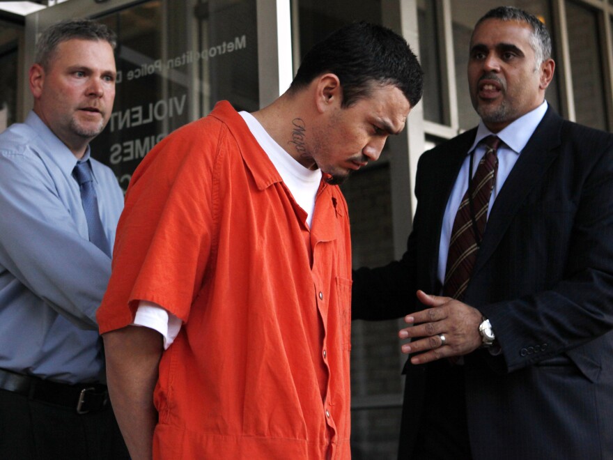 Ingmar Guandique is escorted from the Violent Crimes Unit by police in Washington, D.C., in 2009.