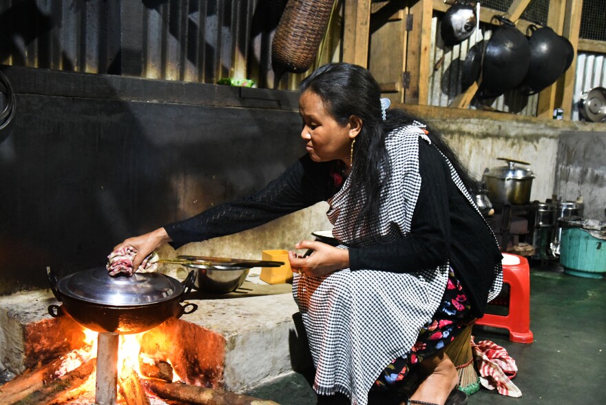 Hosana Mawroh, 47, started her own restaurant three years ago. She says the arrival of tourists "has uplifted us — we send our children to better schools in the capital, wear better clothes, and eat better food." Our life is changed "since we were put on the map," she says. But it is still a lot of hard of work to keep the village clean, she adds.