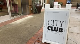 Sandwich board advertising City Club of Eugene