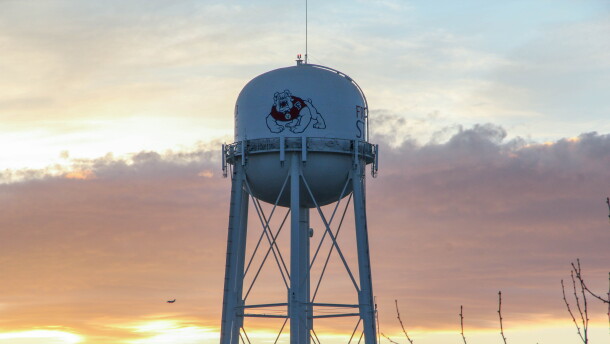 The Fresno State water tower shows the campus bulldog mascot.