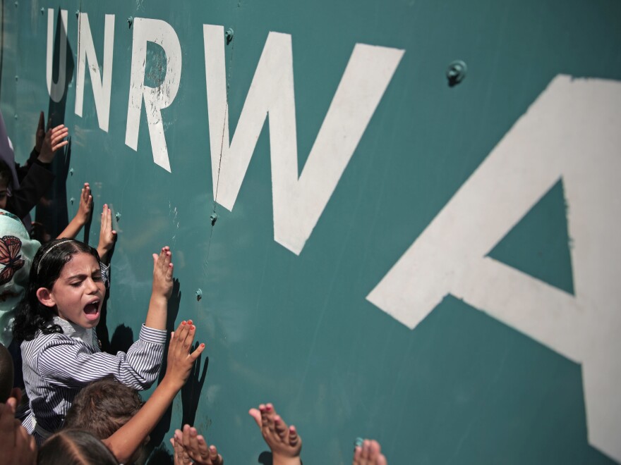 A Palestinian schoolgirl protests against a funding gap at the U.N. Relief and Works Agency in Gaza City, in 2015.