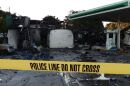 A damaged gas station after protesters set fire to several vehicles and businesses in Milwaukee.