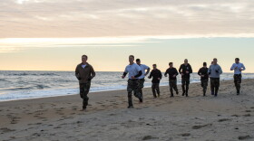 SEAL and SWCC candidates practice in Virginia Beach for Basic Underwater Demolition School (BUD/s). Jan. 1, 2015. Department of Defense.