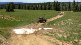 An adaptive drivers navigate the off-road vehicles in the Flat Tops mountain range, July 24, 2023, near New Castle.