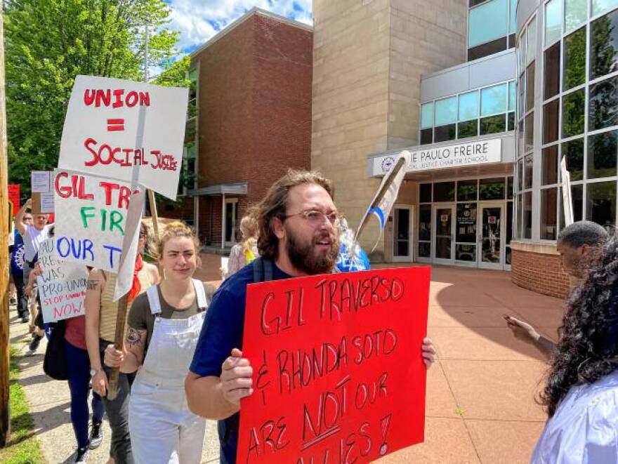 Unionized staff and supporters picket outside the Paulo Freire Social Justice Charter School in Chicopee, Massachusetts, on June 23, 2021. 