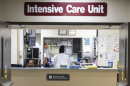 A wide shot of a desk at an intensive care unit inside a hospital. Gov. JB Pritzker’s administration has mailed letters to people who have Medicaid. More than 700,000 people in Illinois will lose, or are at risk of losing, their public health insurance.