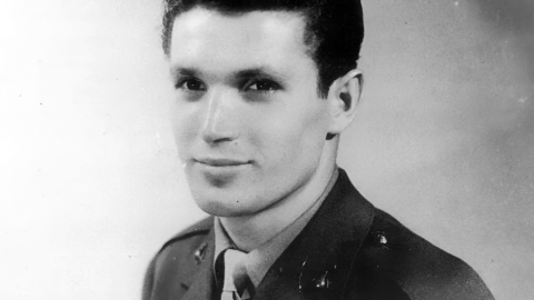  A portrait of a young man who was a World War II veteran, dressed in a U.S. military uniform, looking toward the camera. The photo appears to be from the World War II era.