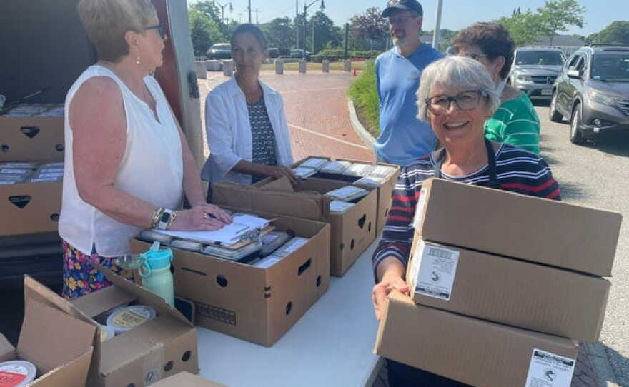 Left to right: Chris Lavenets, Rachel Todoroff, Deke Knight, Carol Flynn (partially obscured), and Kathy Kurniawan delivering in Hyannis.
