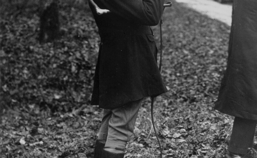 Churchill was known for starting the day with whisky. Here, whip in hand, he takes a nip at his hip flask at the start of a wild boar hunt in France, January 1927.