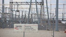 An electrical substation with a sign that says Corn Belt Energy