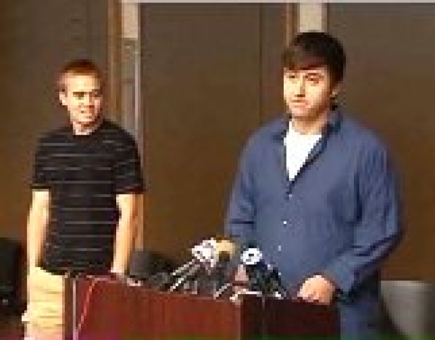 Michael ( L) and David Schnackenberg thank Lenexa police and people of the community.