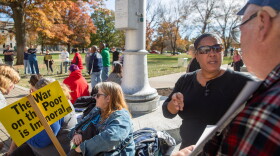 Shelley Owens of Topeka, right, attended a protest of the Kansas foster care system Saturday, saying her three grandchildren were arbitrarily taken from her. She said the agency has traumatized the children and her family. 