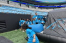 Carolina Panthers wide receiver Tetairoa McMillan spends time with students during the Panthers Field Day at Bank of America Stadium.