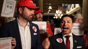 Lt. Governor Micah Beckwith (left) and Secretary of State Diego Morales (right) joined a group of people at the Indiana Statehouse on Tuesday, Nov. 18 in a rally to support new congressional maps that favor Republicans.