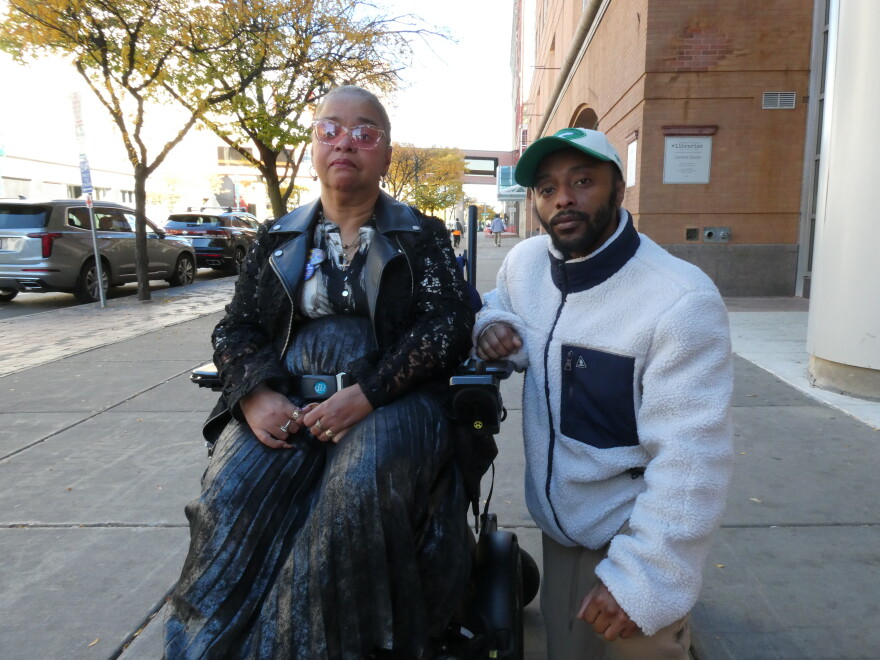Agnes McCray and her son Charles Hudson pose for a photo on South Salina Street in Syracuse. Medicaid's home care support has been essential for McCray, who has cerebral palsy and worries for the program's future.