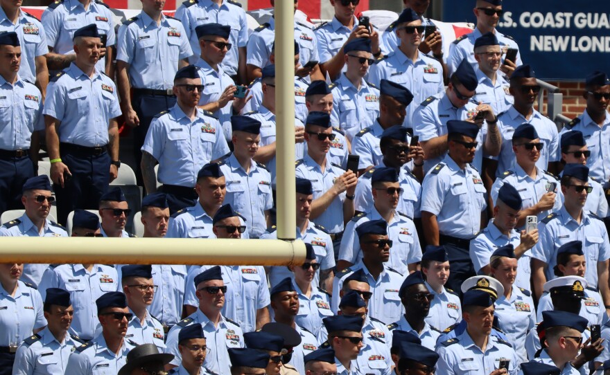 Graduates gather during commencement ceremonies at the U.S. Coast Guard Academy in New London.