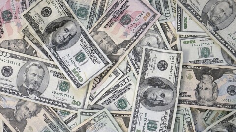 Bills of various quantities in a pile.