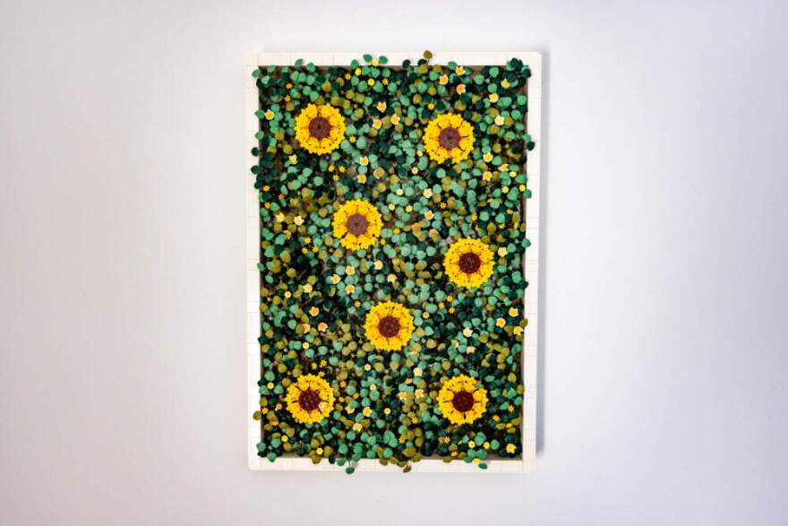 The Modern Brick Haus Moss Garden set hangs on the wall in his office. (Jesse Costa/WBUR)