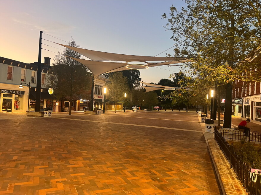 College Square, which re-opened in 2026 as a permanent pedestrian space, tree-lined with brick pavers and shade canopies.