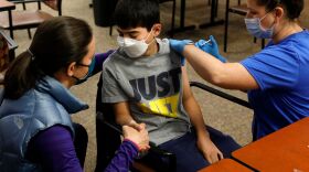 Ari Blank got a comforting hand squeeze from his mom in May as he was vaccinated against COVID-19 in Bloomfield Hills, Mich. This week the U.S. Food and Drug Administration authorized the use of Pfizer's vaccine in even younger kids — ages 5-11. The next step: further guidance from the Centers for Disease Control and Prevention, expected next week.
