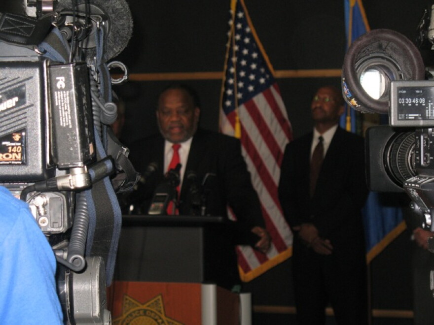 Councilor Jack Henderson talks with reporters