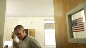 Dave McBee, a U.S. Marine combat veteran of the Iraq War, mops the floor in his quarters at the "Soldier On" veterans homeless shelter, in Leeds, Mass., Thursday, June 26, 2008. McBee fought in Iraq during two tours of duty that included the battle of Fallujah.