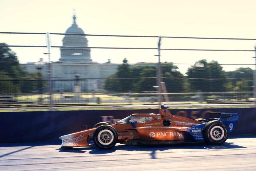 Race car driver Scott Dixon drives his car early for practice near the U.S. Capitol before the IndyCar Freedom 250 Grand Prix auto race in Washington, Sunday, Aug. 23, 2026. (Alex Brandon/AP)