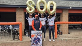 Keystone College baseball Coach Jamie Shevchik poses with three of his players after the Giants won 10-8 on Friday afternoon, earning the coach his 800th victory.