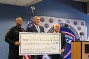 From left, Bloomington Police Chief Jamal Simington, U.S. Rep. Darin LaHood and Bloomington Mayor Dan Brady pose with a ceremonial check acknowledging a nearly $600,000 federal grant used to upgrade the department's Real-Time Information and Crime Center.