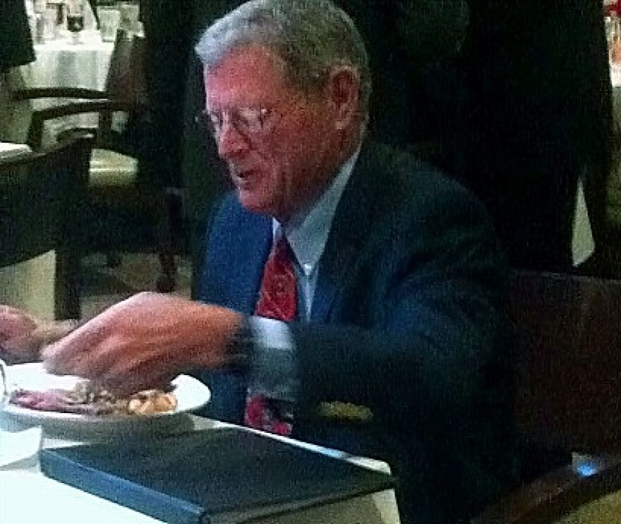 Senator Inhofe eats breakfast before speaking at the Tulsa Press Club.