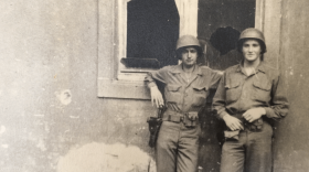 John Waller (right), pictured with a fellow Army service member, was aboard the troop ship SS Léopoldville crossing the English Channel to France on Christmas Eve 1944 when it was torpedoed by a German U-boat and sank. His story is told in the documentary "The Silent Soldier and the Portrait." (Courtesy of the documentary)