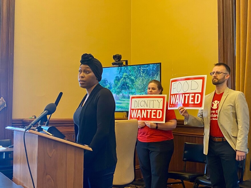 briana jenkins speaks at a press conference