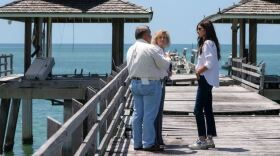 Homeland Security Secretary Kristi Noem speaks with Naples City Manager Gary Young and Naples Mayor Teresa Heitmann on the damaged historic Naples pier in the city on Aug. 29. Records obtained by ProPublica show how the city of Naples found a way to get FEMA aid more quickly: It asked one of Noem's political donors for help. The records show that Noem quickly expedited more than $11 million of federal money to rebuild the historic pier in Naples after she was contacted by a major financial supporter last month. The pier is a Southwest Florida tourist attraction and was badly damaged by Hurricane Ian in 2022.