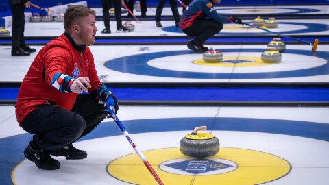 Andreas Hårstad, skip of the Norwegian team, gestures to his teammates at the World Curling Championships in Ogden, March 27, 2026