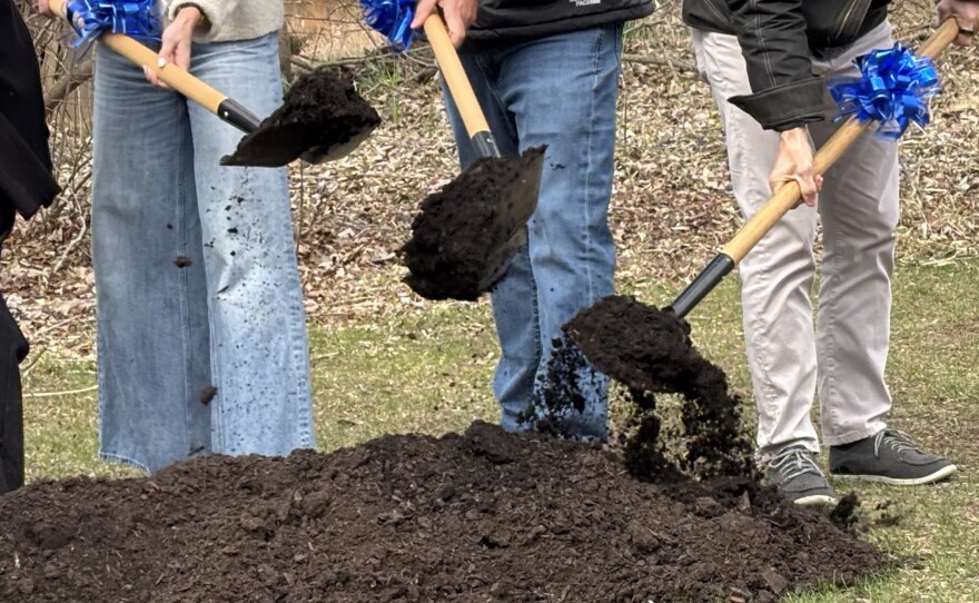 Employees of Custom Built Design and Remodeling break ground on the Stoneleigh Residence expansion for Hospice of Lansing.