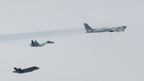 An U.S. F-35 Lightning II fighter, lower left, tracks a Russian Su-35 fighter jet and a Russian Tu-95 bomber over the Bering Sea while escorting the two aircraft last July through the Alaskan Air Defense Identification Zone. Last week, two Alaska-based F-35s and two F-16s and other U.S. aircraft intercepted two formations of Russian planes, including Tu-95s and Su-35s, that flew through the Alaskan Air Defense ID Zone off Alaska's west coast.