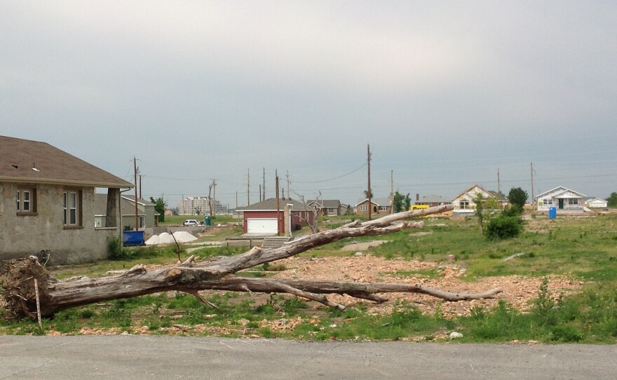 New construction goes up next to left over debris