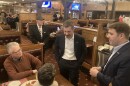 Former Transportation Secretary Pete Buttigieg and U.S. Senate candidate Chris Pappas speak with potential voters in the dining room of the Puritan Backroom Restaurant in Manchester on Feb. 19, 2026.