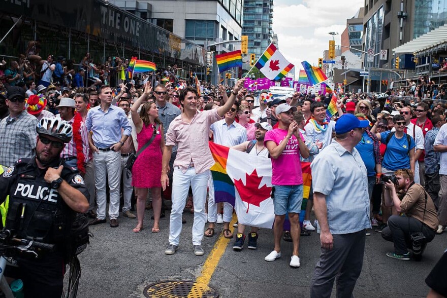 Canadian Prime Minister Justin Trudeau (middle, holding flag) participates at the annual Pride Festival parade, July 3, 2016 in Toronto, Ontario, Canada. Prime Minister Justin Trudeau will make history as the first Canadian PM to march in the parade. (Ian Willms/Getty Images)