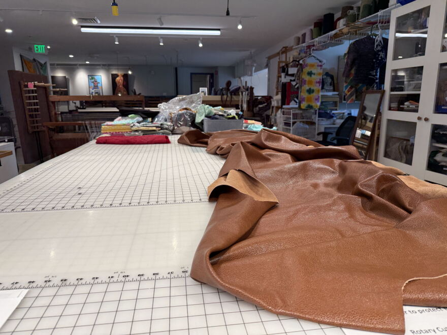 The newly arrived, huge piece of leather that Jennifer MacLean and Courtney Drake plan to work with.