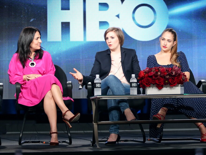 <em>Girls</em> executive producer Jenni Konner (from left), creator and star Lena Dunham and actress Jemima Kirke take questions on the first day of the Television Critics Association winter press tour.