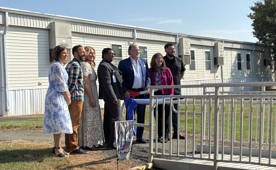 District officials, school staff, church and health partners prepare to cut the ribbon on the new clinic on Sept. 18, 2026.
