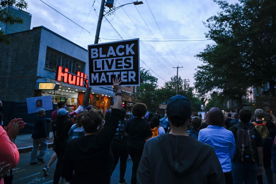 Protestors walk down Chapel St in New Haven. They held up traffic in some intersections for minutes at a time.