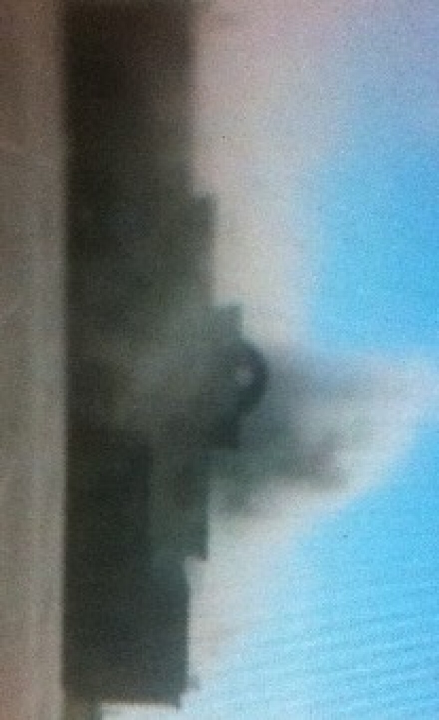 Smoke fills the air around the restaurant before fire trucks arrived.