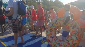 Polar Plunge participants wait to enter the pool at Adventure Island on Saturday, March 23.