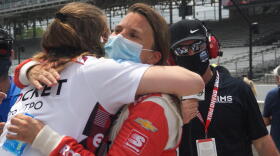 Driver Simona de Silvestro hugs one of her Paretta Autosport teammates after qualifying for the Indianapolis 500.