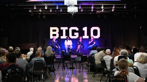Panelists speak on the stage about the cost of AI data centers as Tulsa residents listen in during the Tulsa forum organized by the Foundation for Real Economic Emancipation.